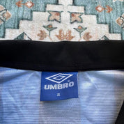 Umbro blue and navy striped home jersey with embroidered logo and vintage design.