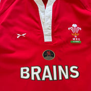 Reebok men's polo shirt red with Wales Rugby logo and slim fit design.