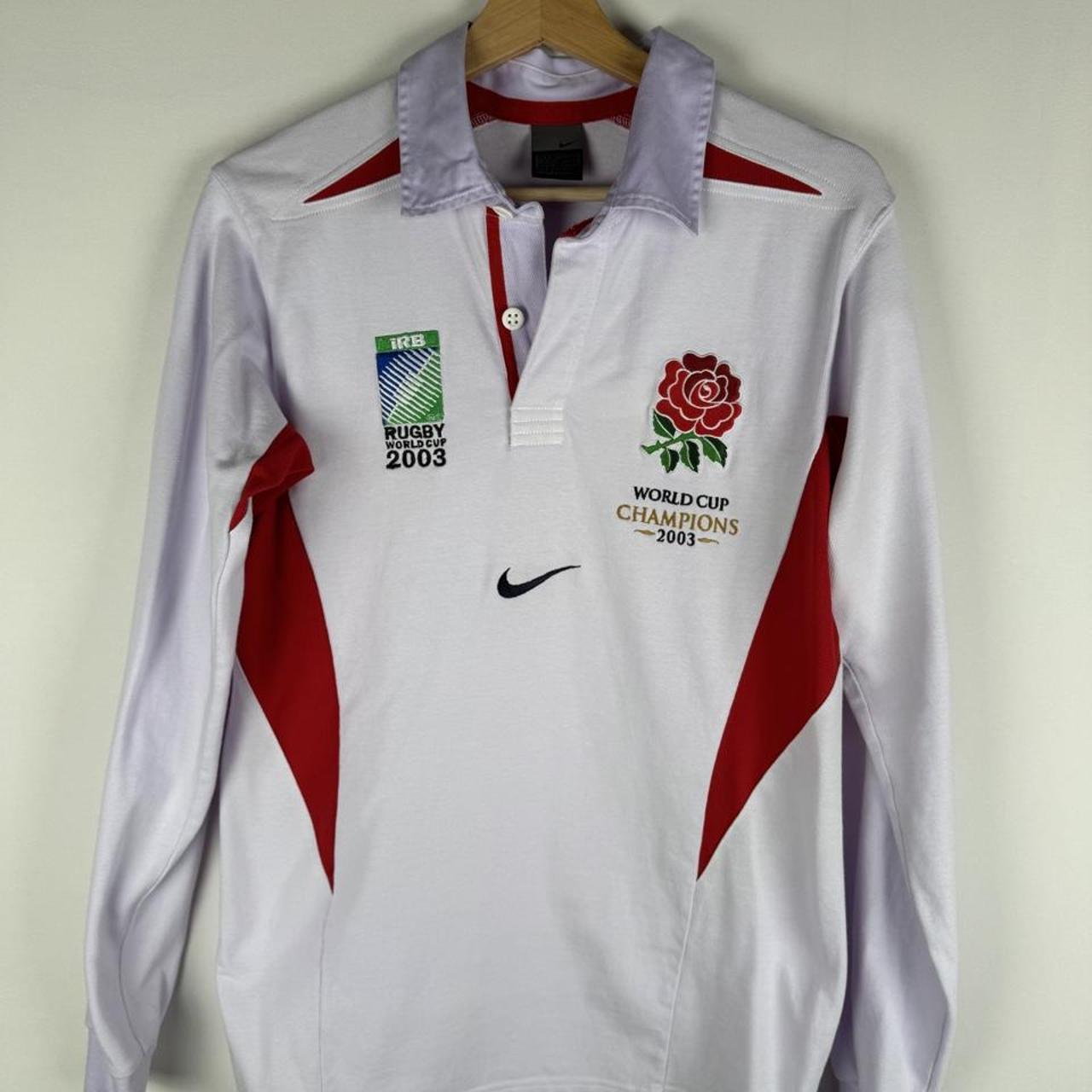 Nike men's polo shirt white with embroidered England Rugby logo and World Cup details.