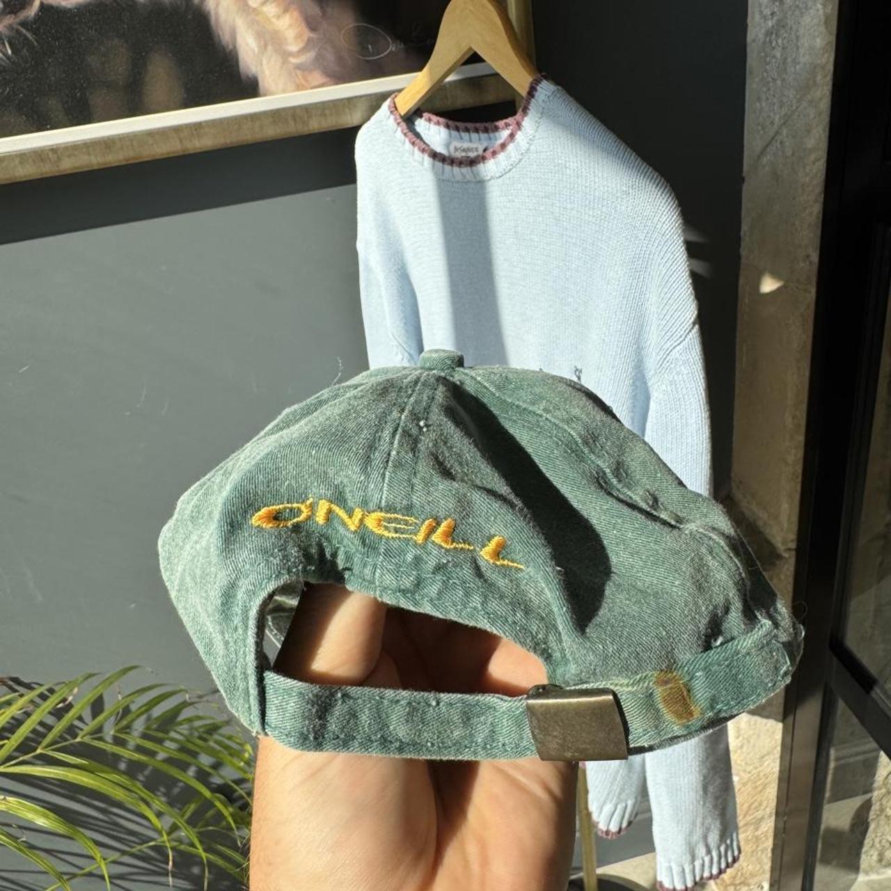 O'Neill green surf cap with vintage logo and adjustable strap.