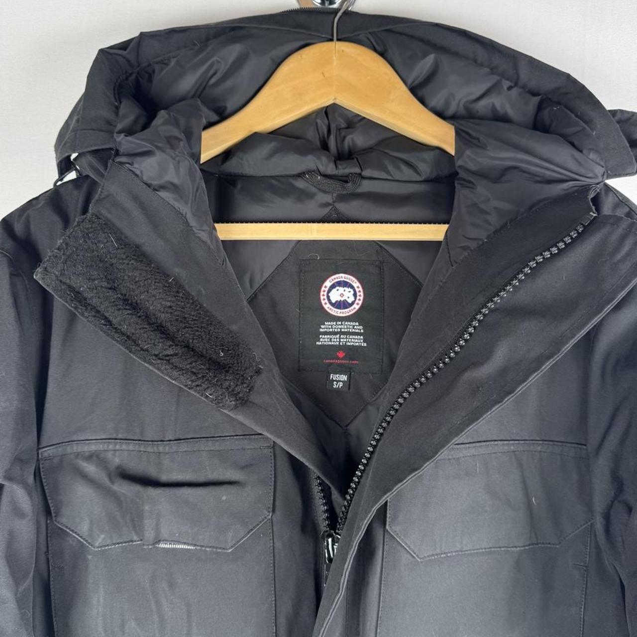 Canada Goose black parka jacket oversized fit with utility pockets and logo patch.