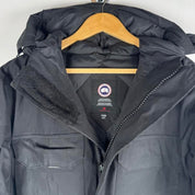 Canada Goose black parka jacket oversized fit with utility pockets and logo patch.