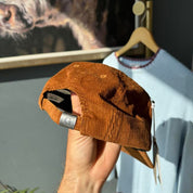 Carhartt WIP hat brown corduroy with embroidered logo and rugged design.