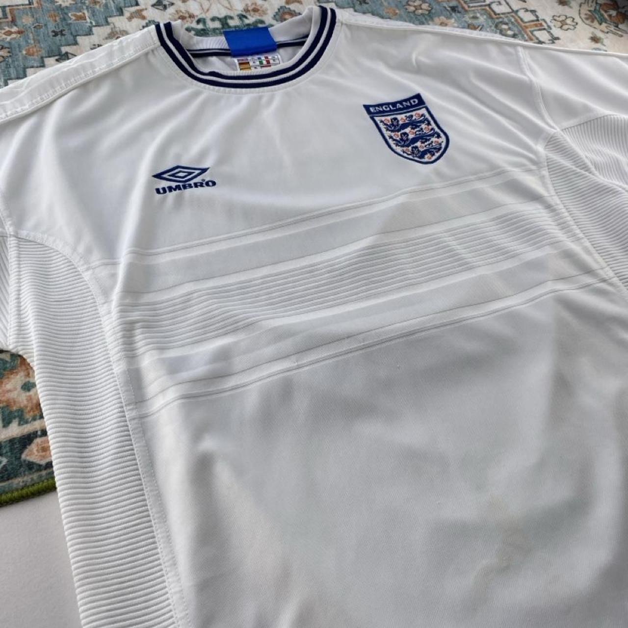 Umbro England home jersey, red with white logo and classic football design.