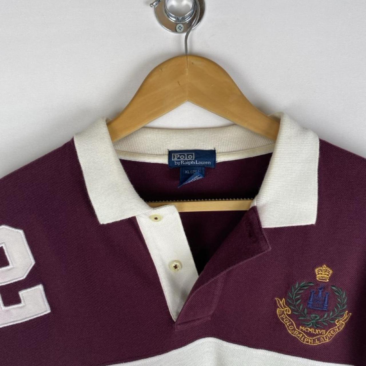 Polo Ralph Lauren burgundy rugby polo shirt with white stripes and embroidered logo.