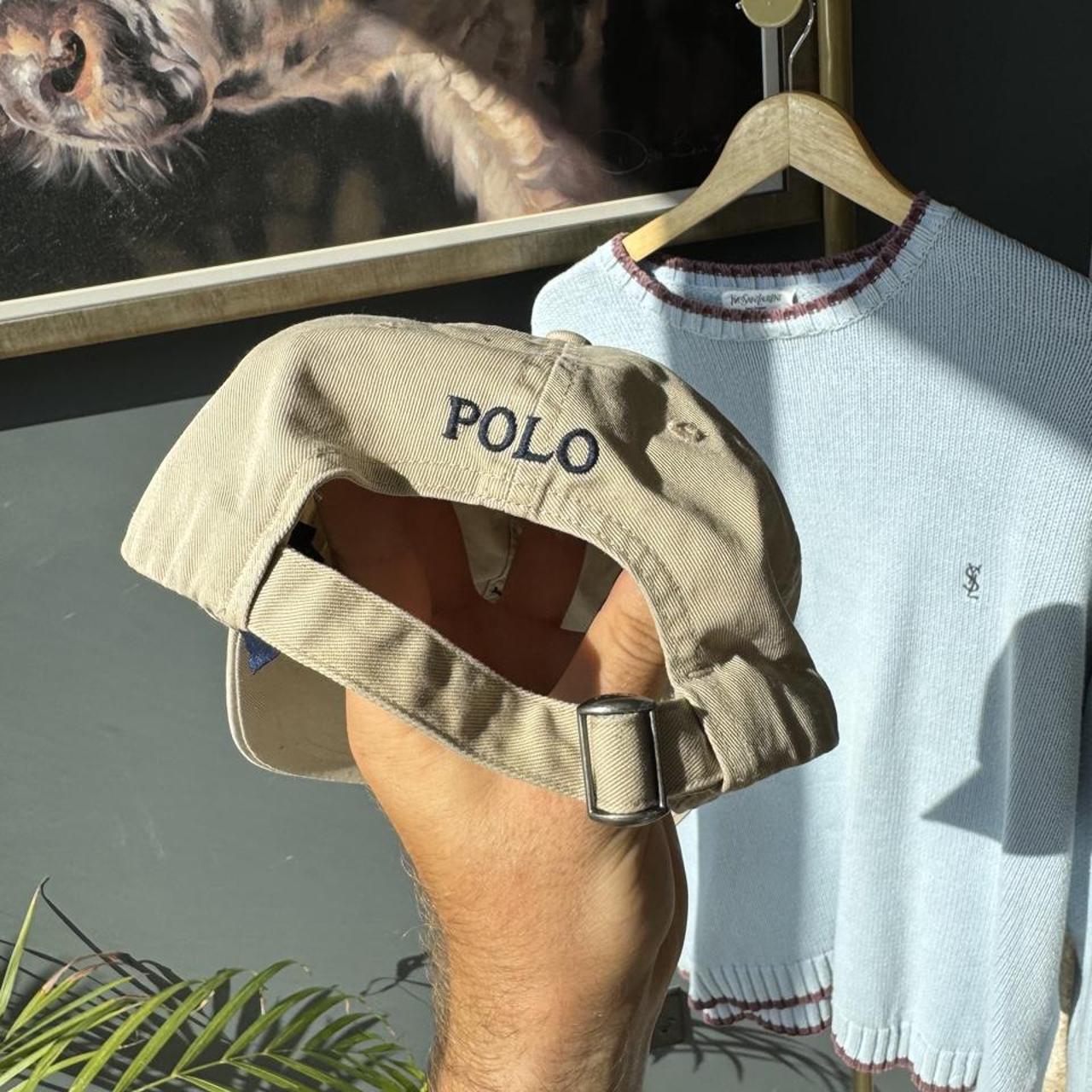Polo Ralph Lauren tan cap with embroidered logo and adjustable strap.