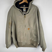 Carhartt active jacket, orange, oversized fit, visible logo, durable material.