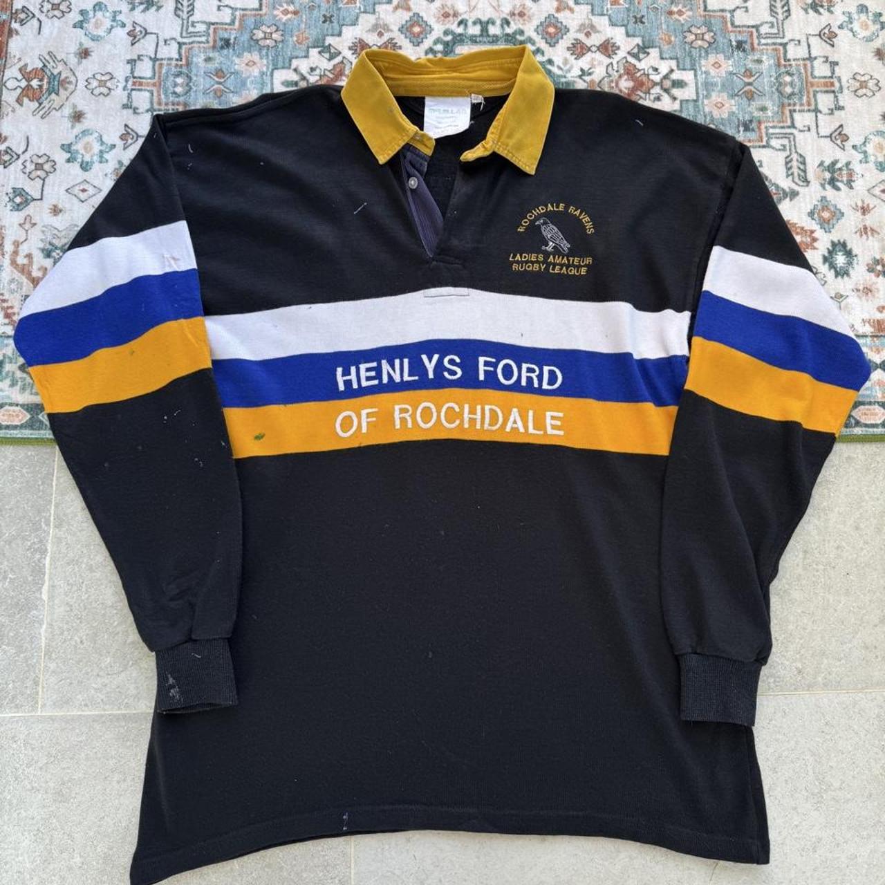 Rochdale Ravens women's 1990s rugby polo, black with logo and vintage design details.