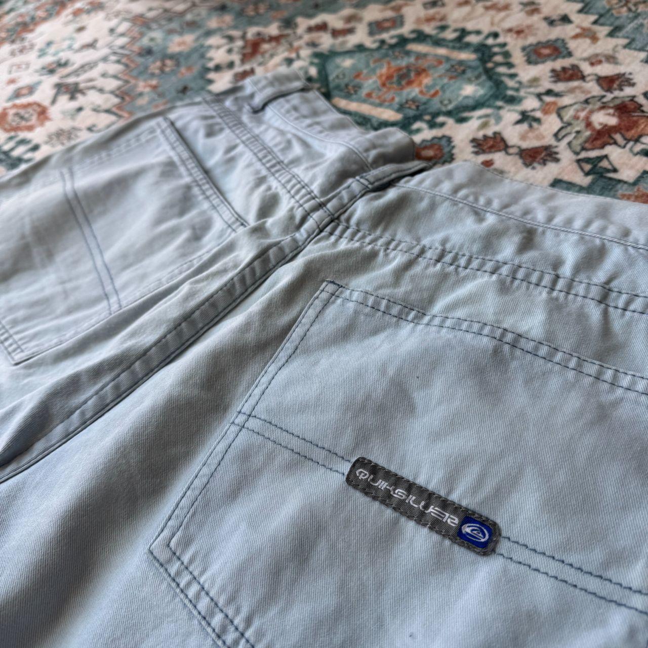 Quiksilver baby blue surf shorts 100% cotton with logo and classic design details.
