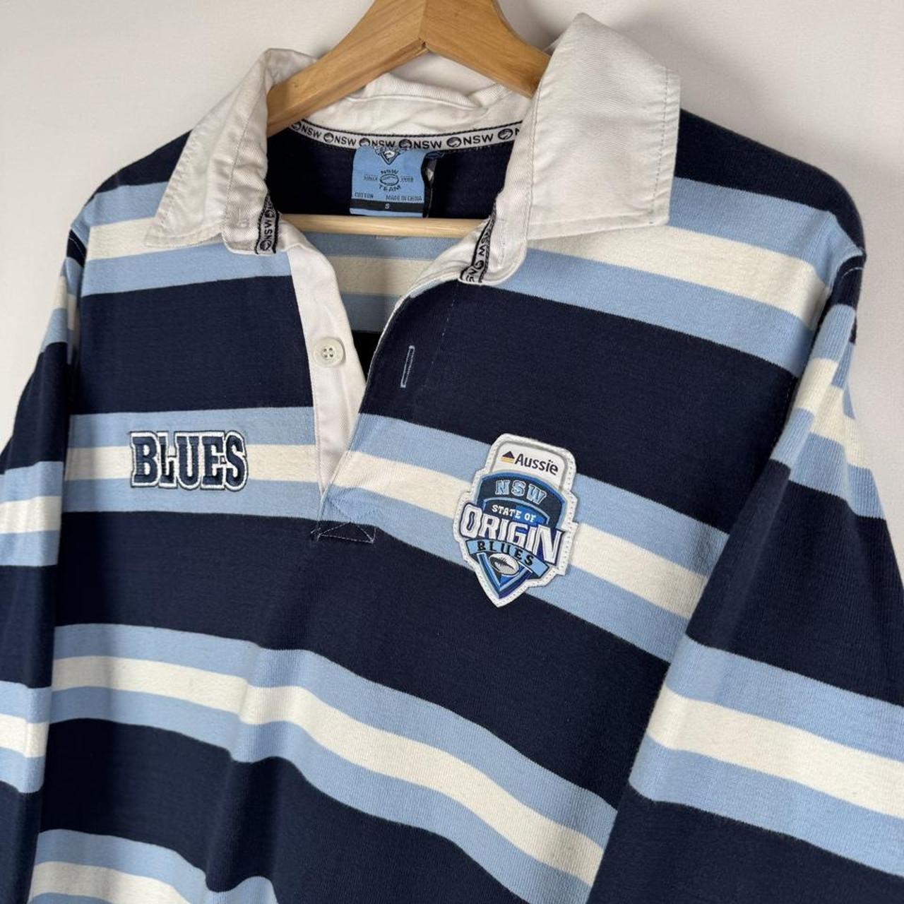 State Of Origin blue rugby polo shirt with logo and slim fit design.