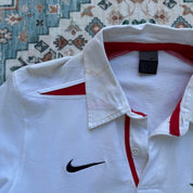 Nike England rugby polo shirt, red with embroidered logo and white collar details.