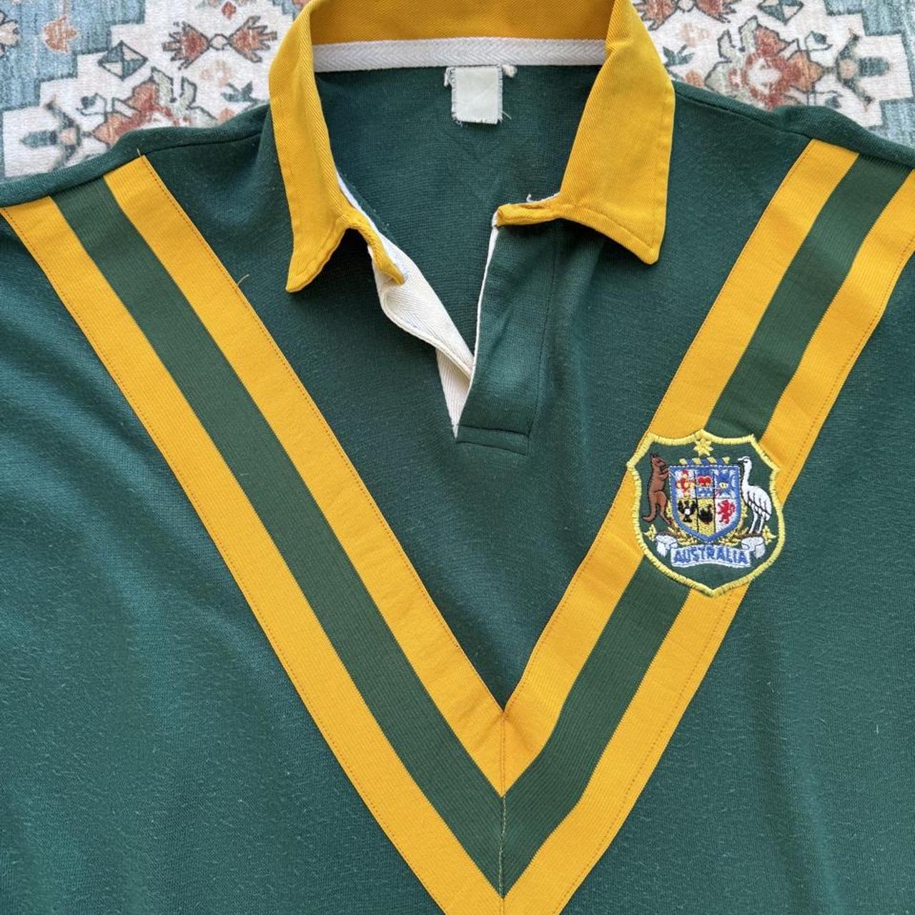 1990s Australia Wallabies rugby polo green with embroidered logo and classic collar.