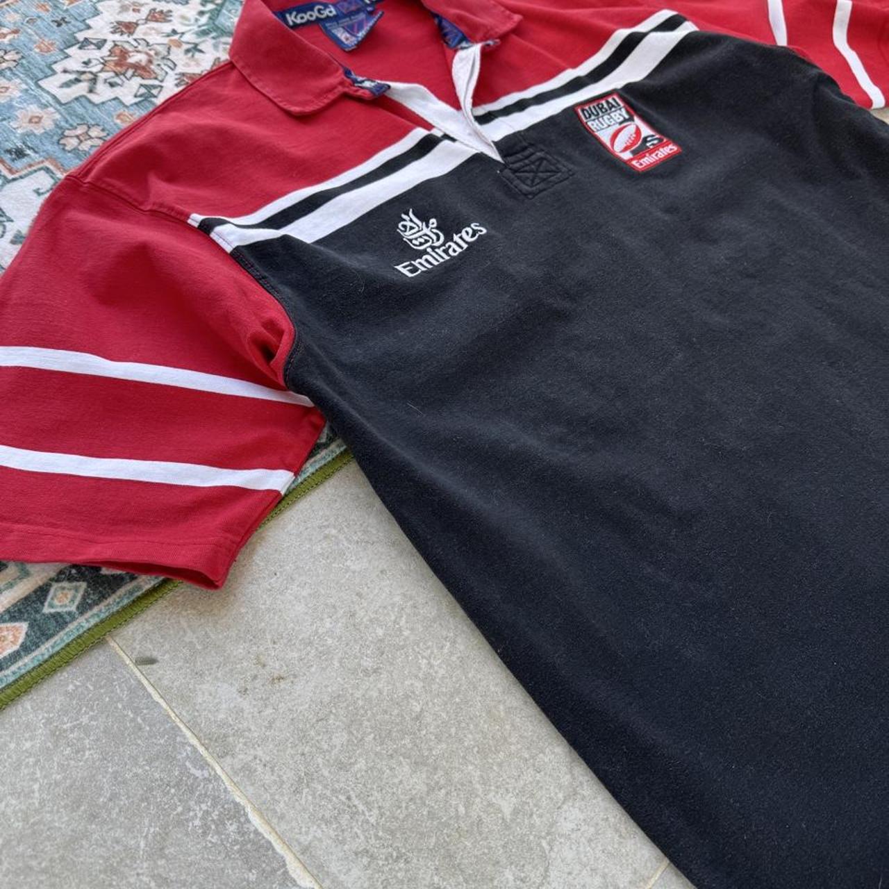 Kooga men's rugby polo shirt, navy blue, embroidered Dubai 7s logo, cotton material.