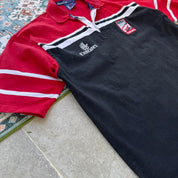 Kooga men's rugby polo shirt, navy blue, embroidered Dubai 7s logo, cotton material.