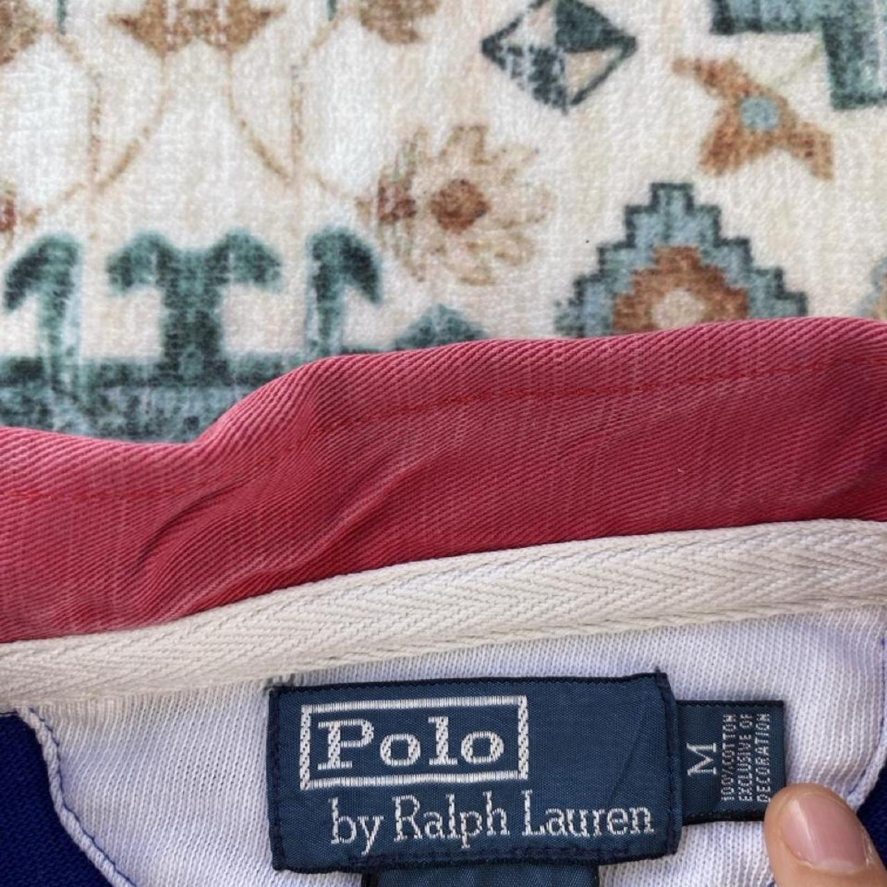 Polo Ralph Lauren blue and white striped rugby polo shirt with embroidered logo.