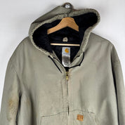 Carhartt active jacket, orange, oversized fit, visible logo, durable material.
