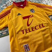 Adidas orange Benfica away jersey with embroidered logo and vintage design details.