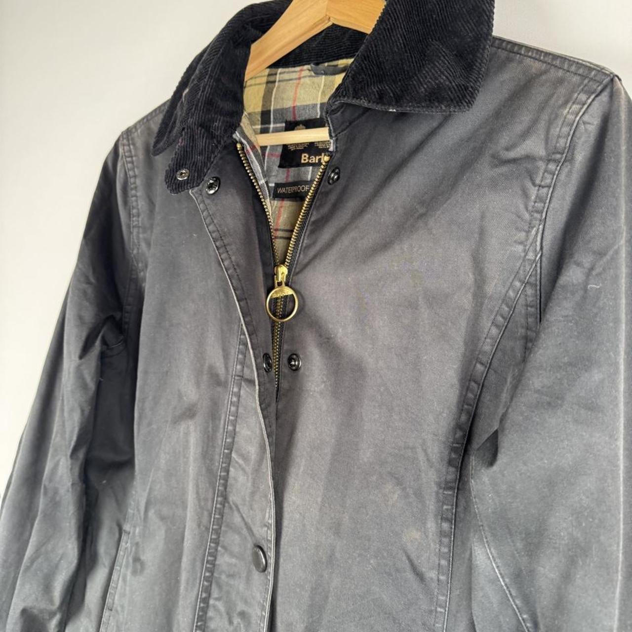 Barbour cream lightweight jacket with logo detail and slim fit design.
