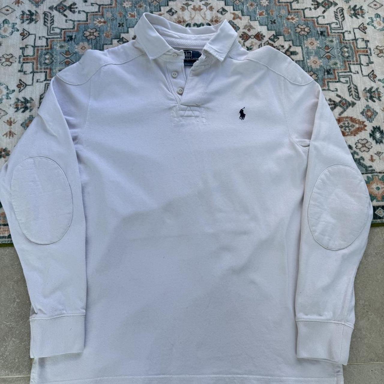 Polo Ralph Lauren white rugby polo shirt with embroidered logo and thick fabric.