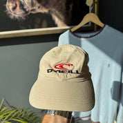 O'Neill cream hat with embroidered logo and vintage design details.