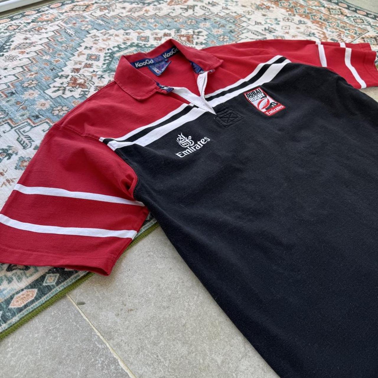 Kooga men's rugby polo shirt, navy blue, embroidered Dubai 7s logo, cotton material.