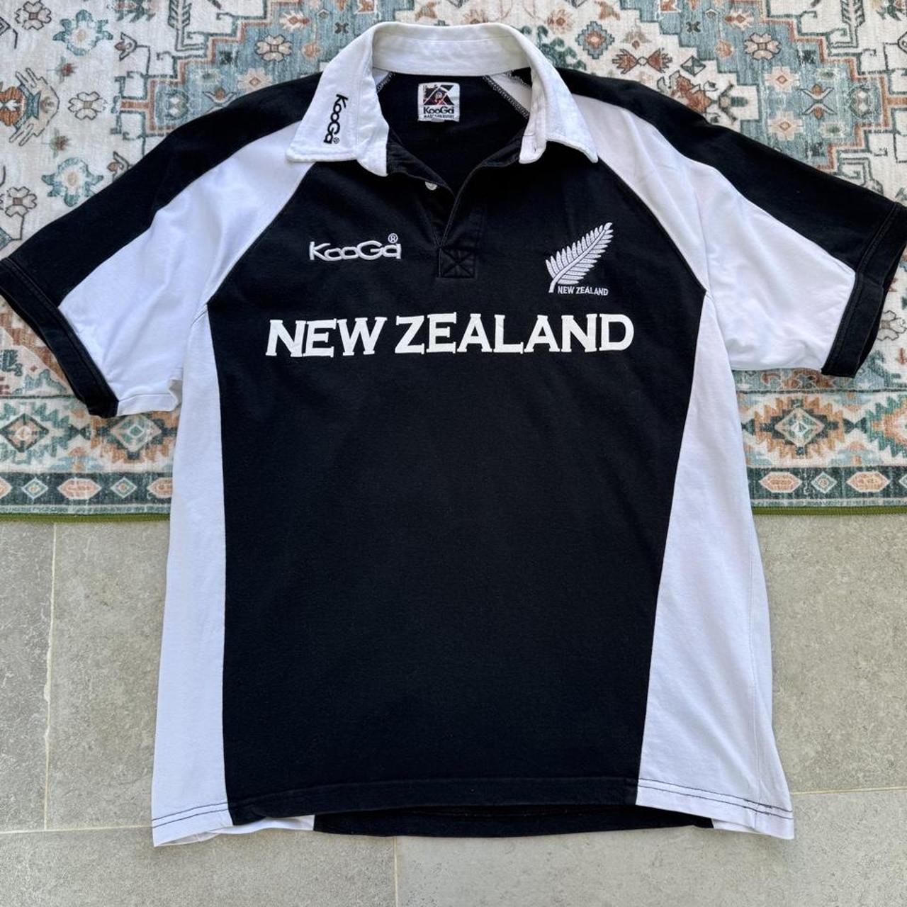 Kooga men's polo shirt, green with embroidered New Zealand logo and rugby collar.
