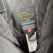 Canada Goose black and brown parka jacket with logo and utility pockets.