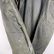 Barbour green waxed Beaufort jacket with attached hood and classic logo detail.