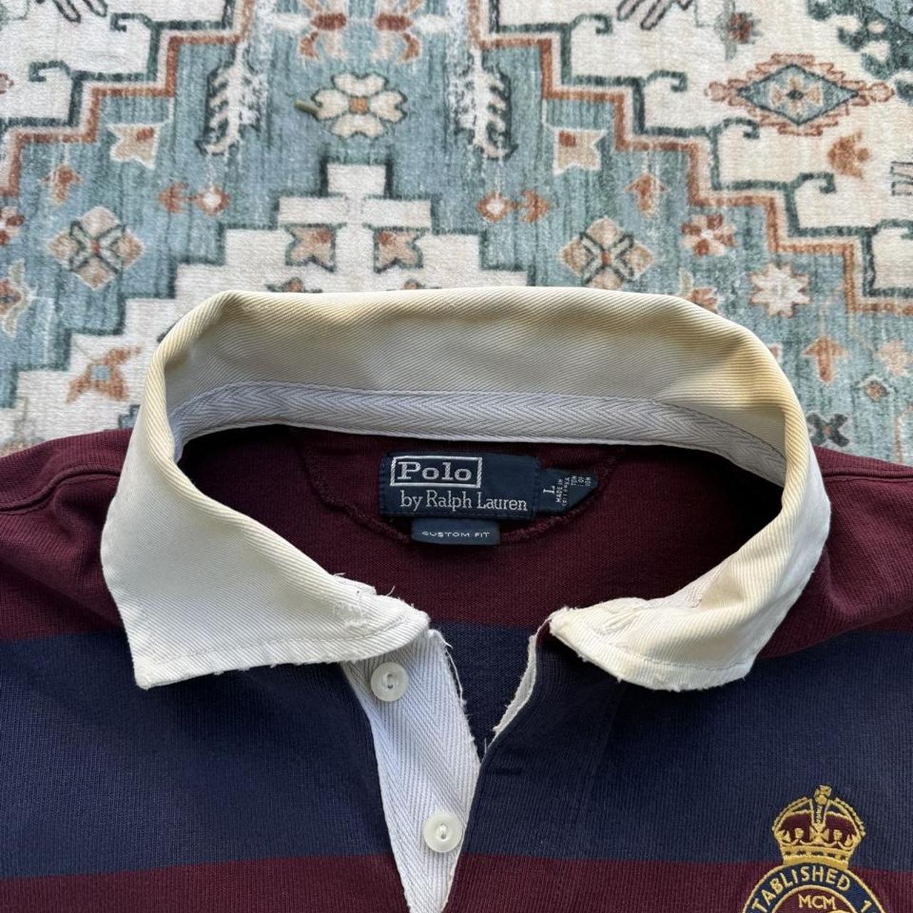 Polo Ralph Lauren burgundy and yellow short sleeve rugby polo with logo and collar details.