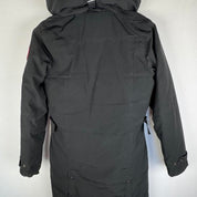 Canada Goose black parka jacket with logo patch and fur-lined hood.