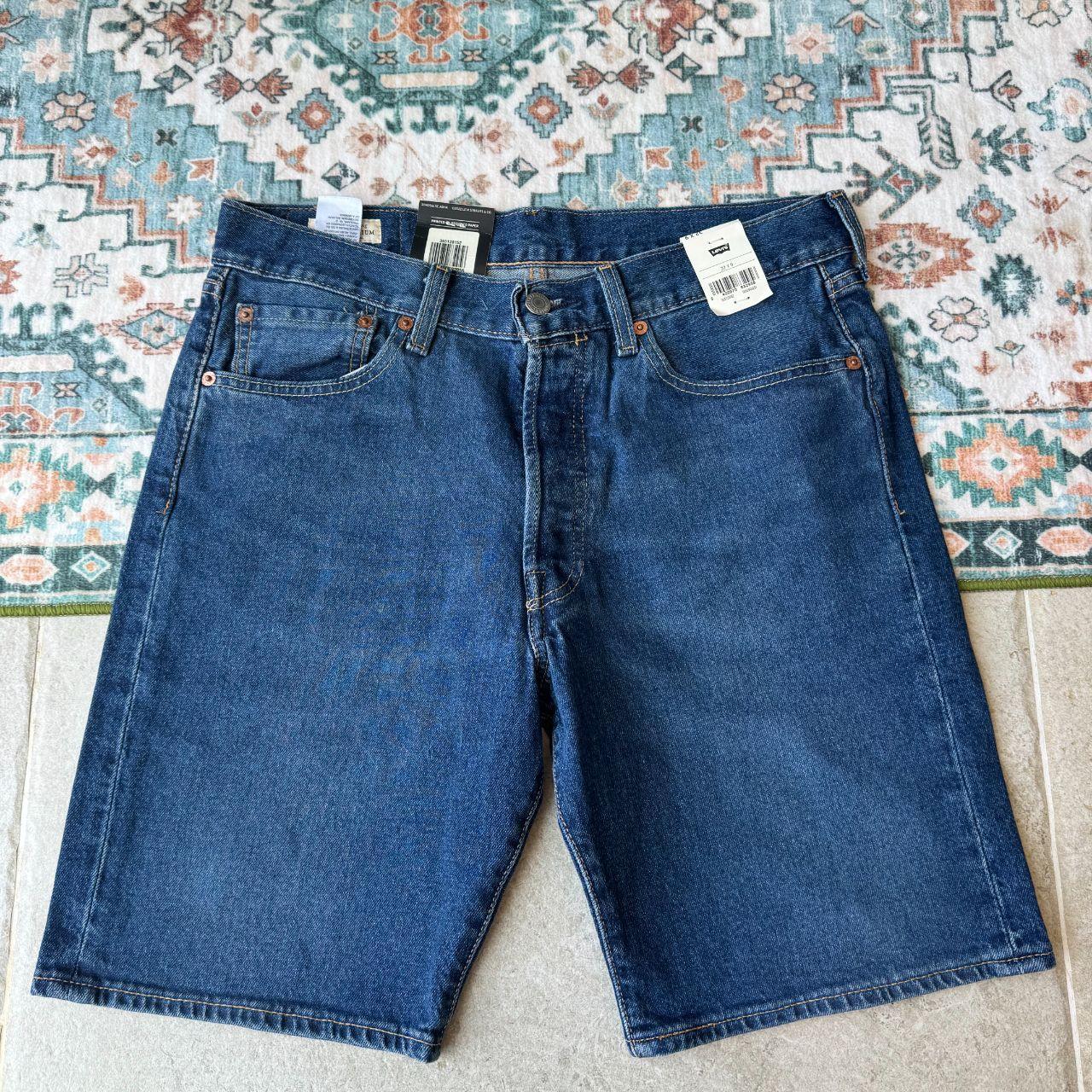 Levi's denim 501 shorts blue with classic logo patch and five-pocket design.