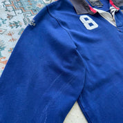 Hackett cream rugby polo with embroidered spellout logo and thick cotton material.