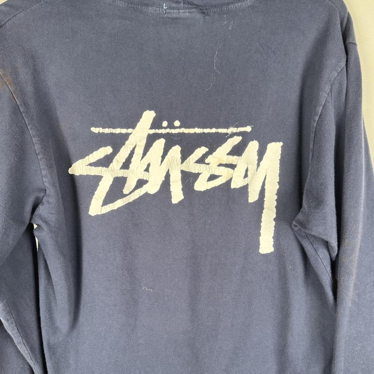 Stüssy grey hoodie with back print spellout logo, slim fit, cotton material.