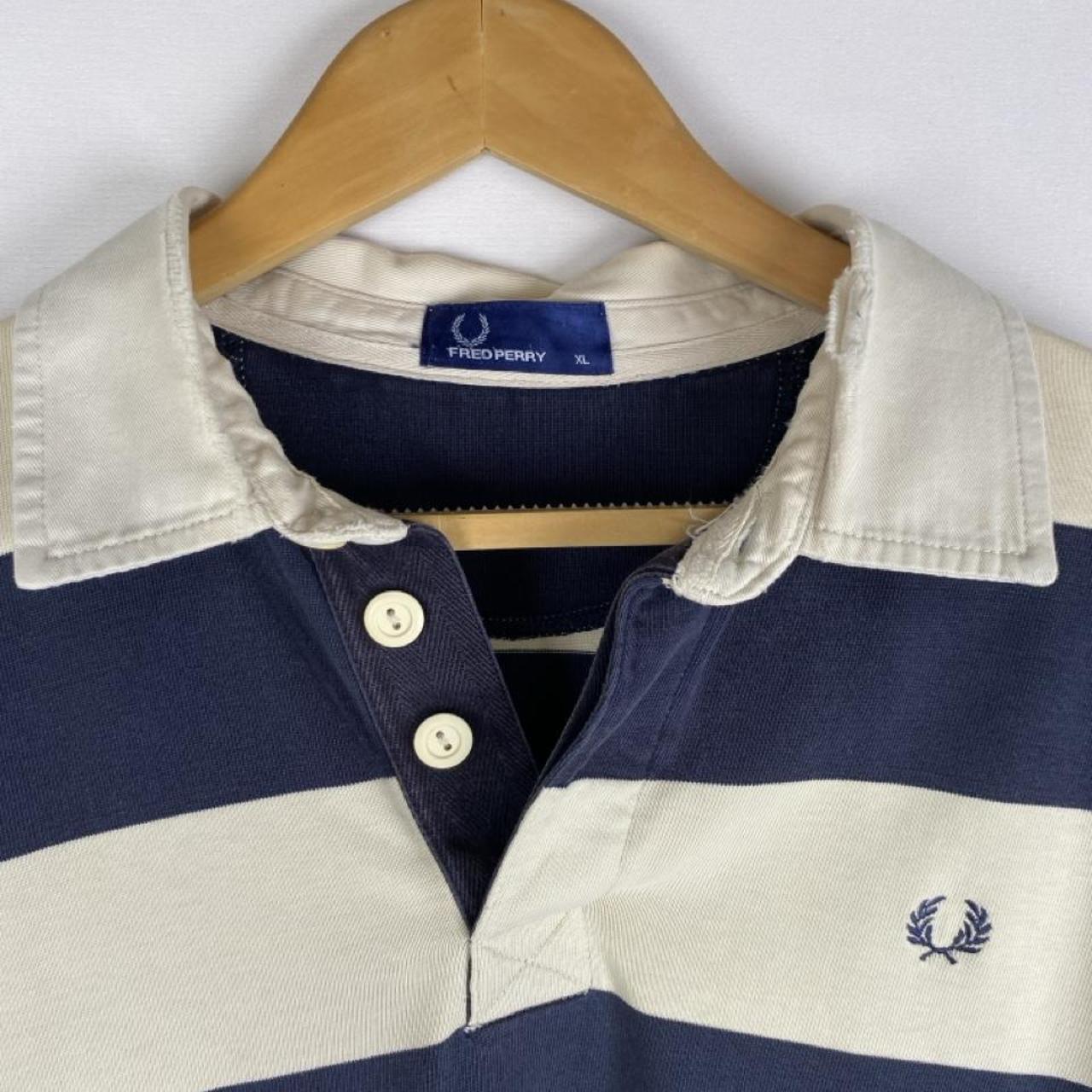 Fred Perry men's rugby polo shirt cream and navy stripes with logo detail.