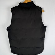 Canada Goose black puffer gilet with logo patch and quilted design.