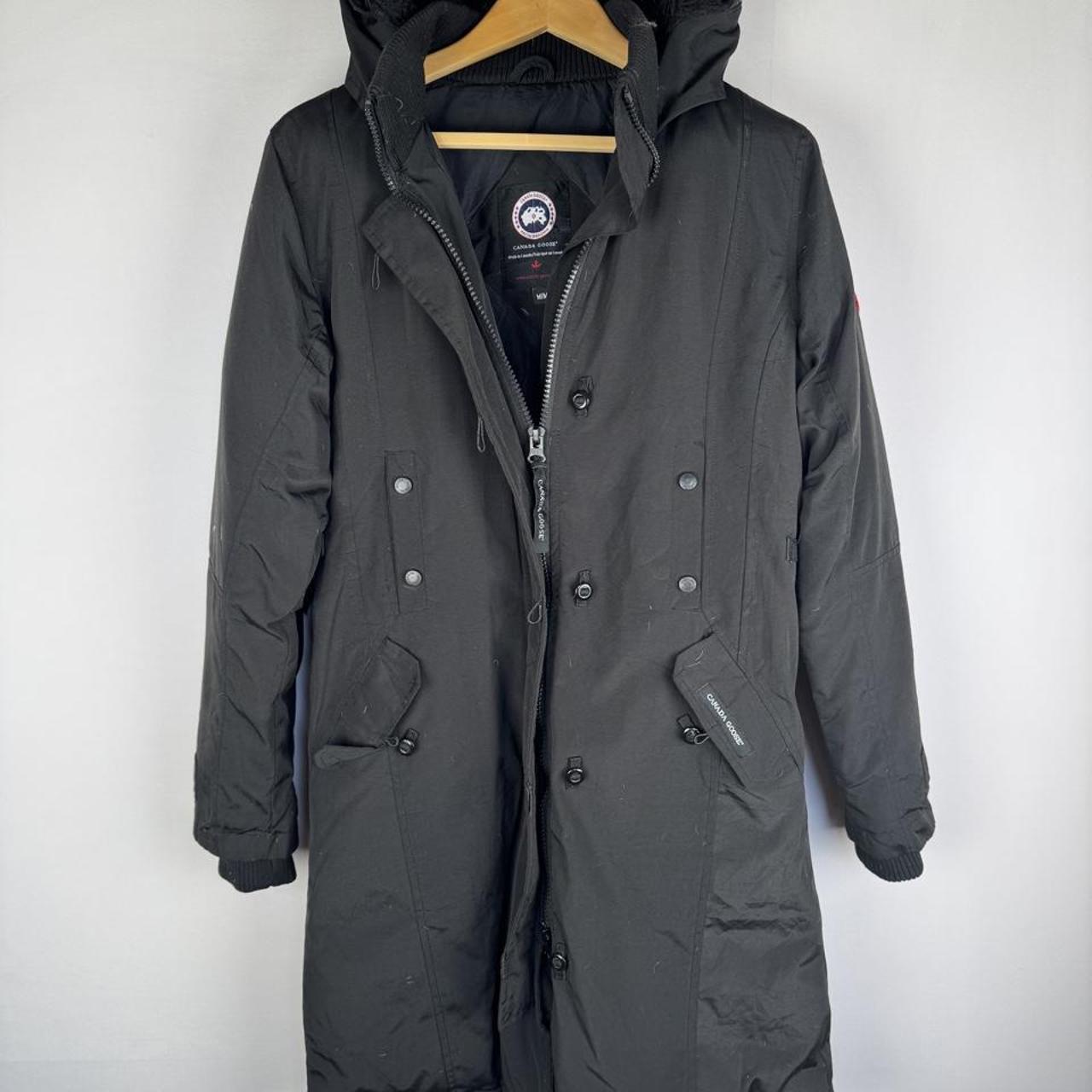 Canada Goose black parka jacket, medium size, features logo patch and sleek design.