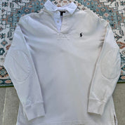 Polo Ralph Lauren cream rugby polo shirt with embroidered logo and classic collar.