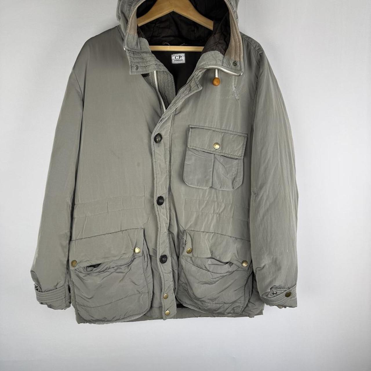 CP Company multi-colour utility parka jacket with multiple pockets and hood.