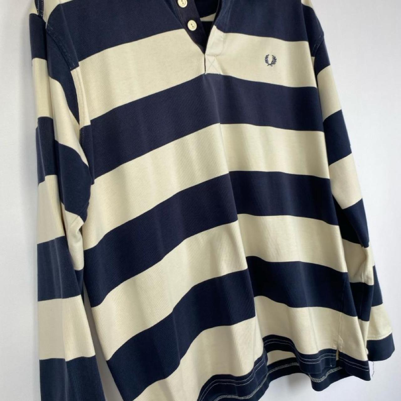 Fred Perry men's rugby polo shirt cream and navy stripes with logo detail.