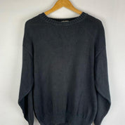 Yves Saint Laurent grey knitted jumper 1990s style with relaxed fit and ribbed texture.