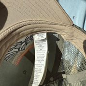 Patagonia khaki trucker cap with embroidered logo and mesh back.