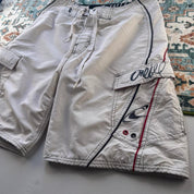 O'Neill cream board shorts with embroidered logo and relaxed baggy fit.