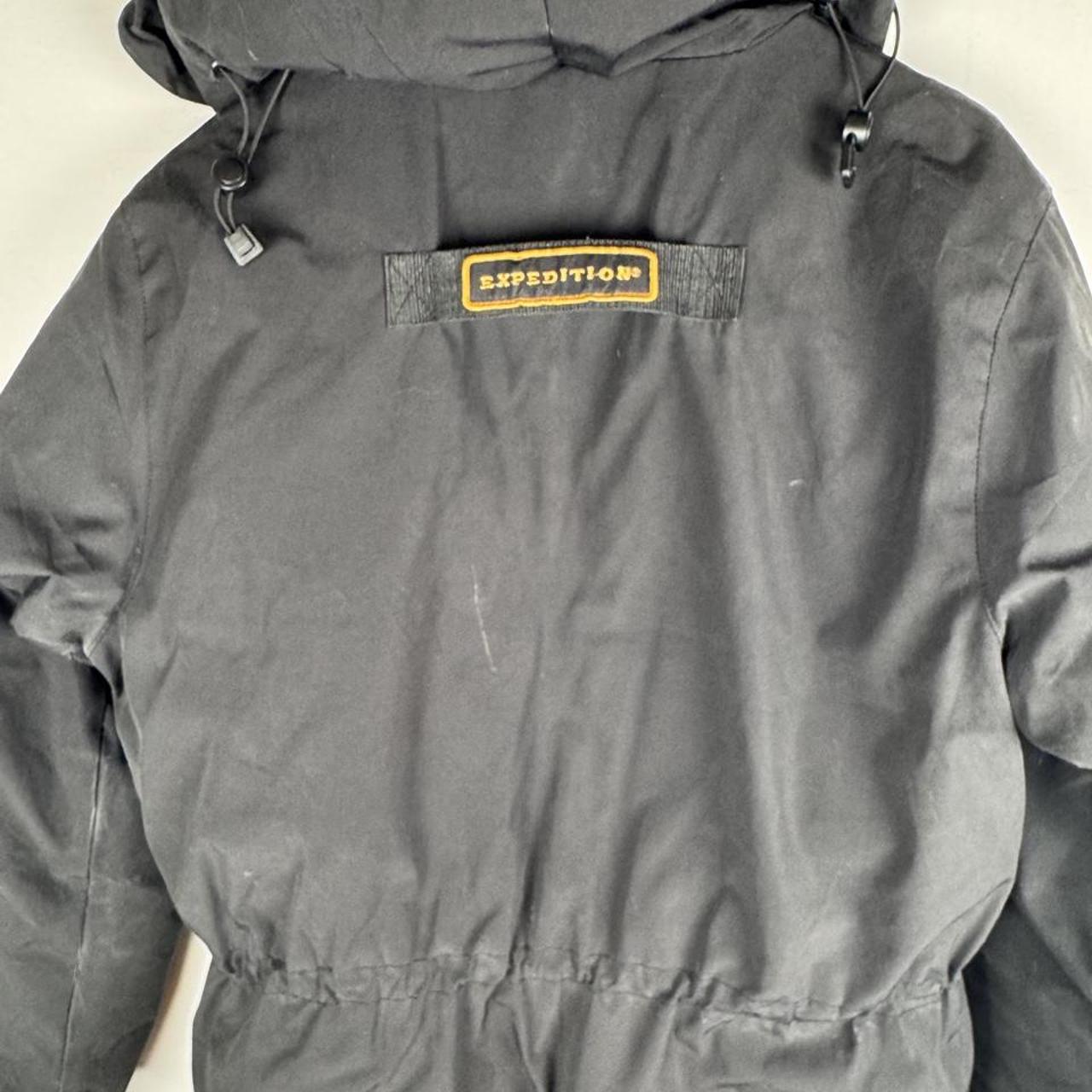 Canada Goose black parka jacket oversized fit with utility pockets and logo patch.