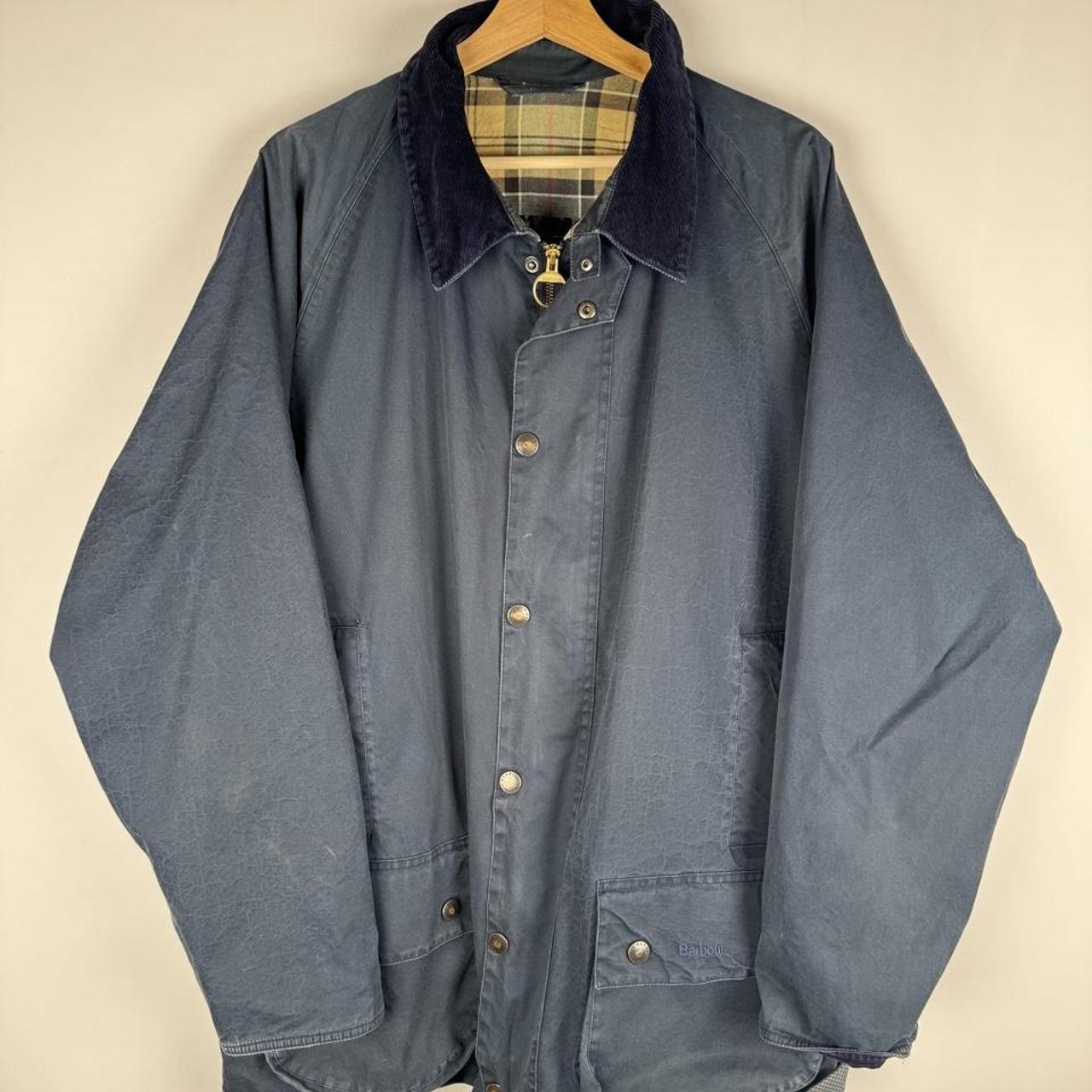 Barbour blue lightweight jacket with logo, relaxed fit, and classic design.