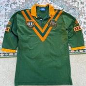 Umbro men's polo shirt green with Wallabies logo and rugby league pattern.