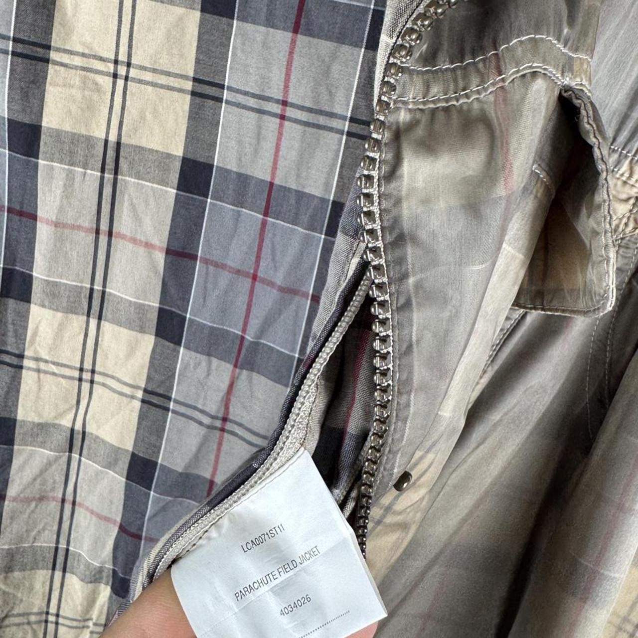 Barbour cream checkered parachute field jacket with relaxed fit and distinctive logo.
