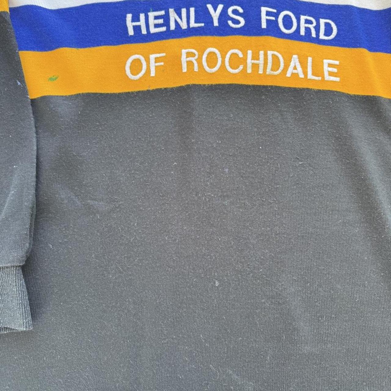 Rochdale Ravens women's 1990s rugby polo, black with logo and vintage design details.