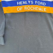 Rochdale Ravens women's 1990s rugby polo, black with logo and vintage design details.