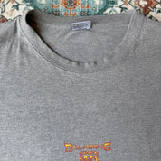 Billabong oversized graphic t-shirt blue with cream and green patterns, featuring pocket detail.