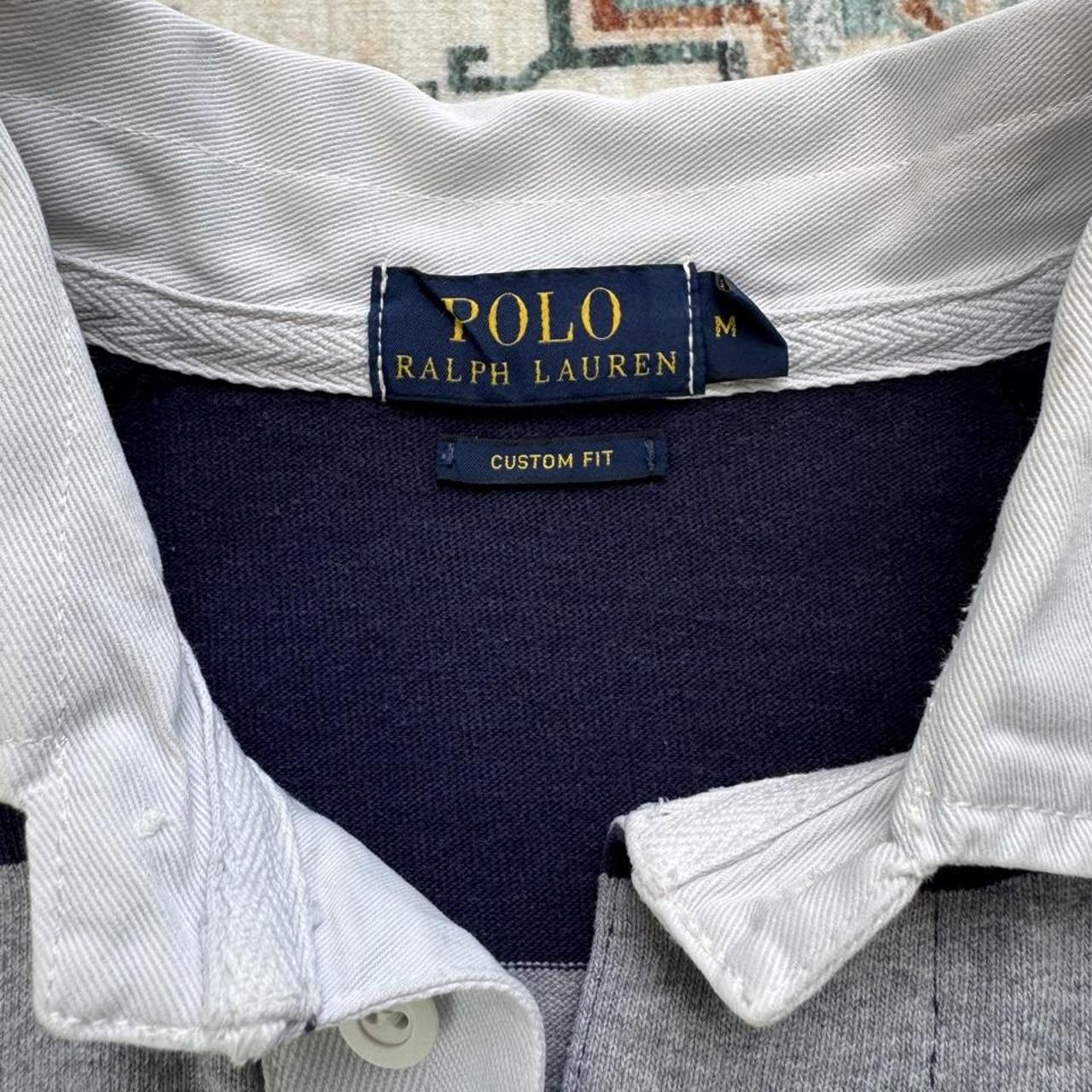 Polo Ralph Lauren navy rugby polo shirt with thick stripes and embroidered logo.